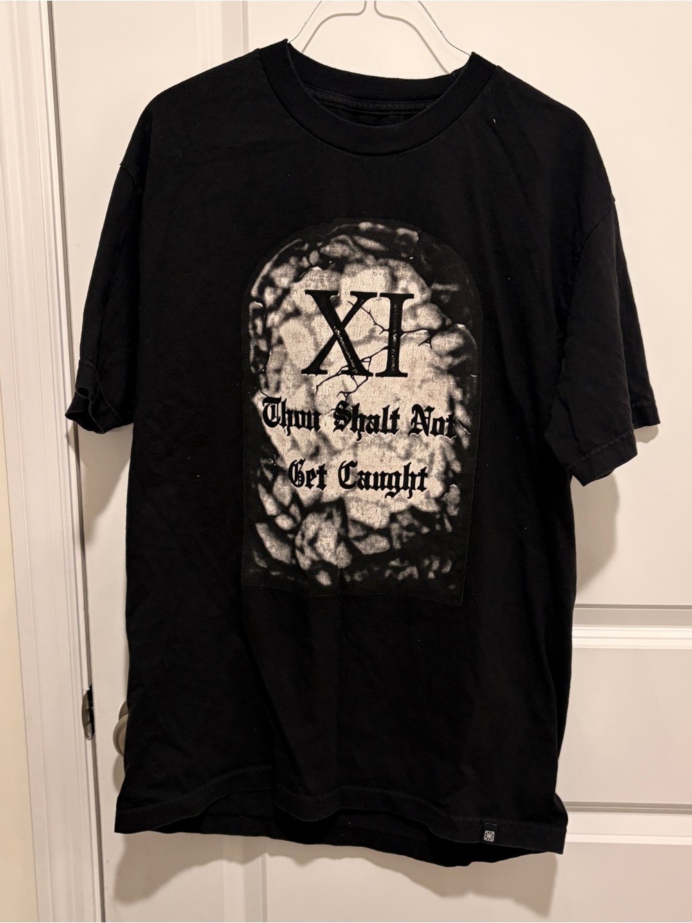 The Seventh letter XI Black Graphic Tee - "Thou Shalt Not Get Caught"
